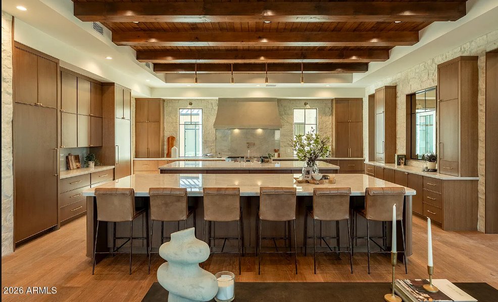 Double-island kitchen cabinetry in a Montecito-inspired Paradise Valley estate